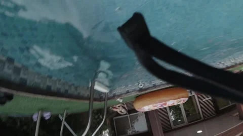Slow motion 240 fps camera fall into pool ending underwater Stock Footage 318918190