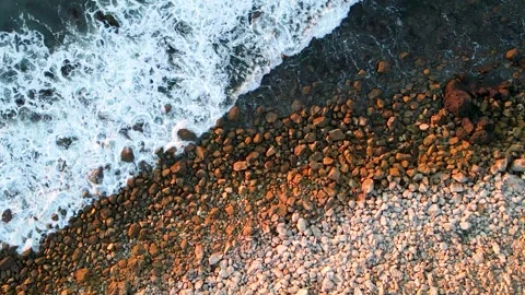 Slow Motion 240 fps Plan View of Water Crashing into Rocks Stock Footage 145450668