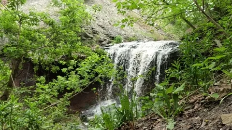 Slow motion 240fps footage of Devil's Punch Bowl waterfall in Hamilton Stock Footage 339070939