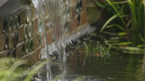 Slow motion - (2k @ 200fps) of garden water feature. Stock Footage 146136173