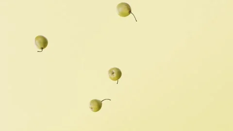 Slow motion 3D animation video of green pears falling from above Видео 263860166