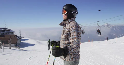 Slow Motion 4K Portrait Shot Of Skier Inviting To Skiing On Sunny Winter Day Stock Footage 47086784