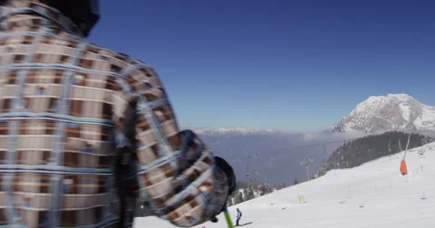 Slow Motion 4K Rear View Of Skier Expressing Achievement On Mountain Top Stock Footage 47090021