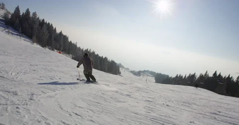 Slow Motion 4k Rear View Of Skier Carving Down The Snowy Slope Stock Footage 47092146