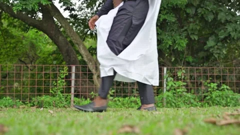 Slow motion 4k resolution of the legs of an African male in Babariga. Stock Footage 283985306