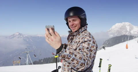 Slow Motion 4K Of Skier Making Video Call To Friends From Ski Resort Stock Footage 47087972