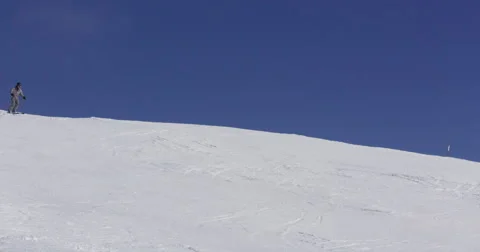 Slow Motion 4k Of Skier Skiing On Sunny Winter Day With Clear Blue Sky Stock Footage 47090743