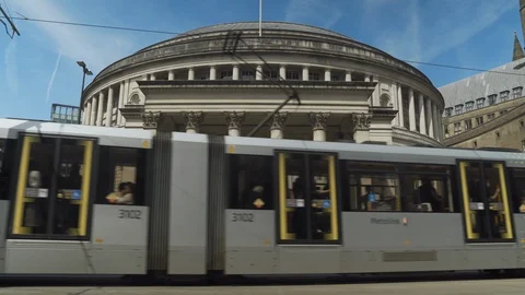 SLOW MOTION 4k tram passes in front of Central Library Manchester, UK. Stock Footage 108567355
