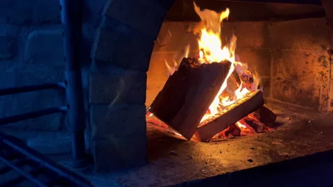 Slow motion 4K video of burning dry woods in the brick outdoor country house man Stock-Footage 221278006