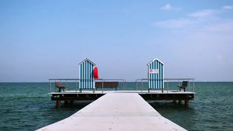 Slow motion 4K video of end of pier and bathing station on Baltic sea Video stock 156202680
