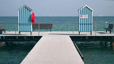 Slow motion 4K video of end of pier and bathing station on Baltic sea Video stock 156203785