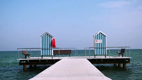 Slow motion 4K video of end of pier and bathing station on Baltic sea Video stock 156204062