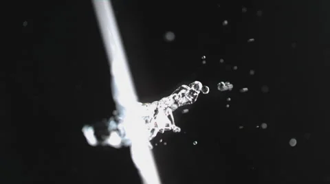 Slow motion 4k, water drops falling, splashing and creating turbulent ripples Stock Footage 63845371
