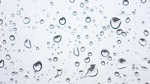 Slow motion 4k. Water drops on clean glass as a natural background Stock Footage 150377107