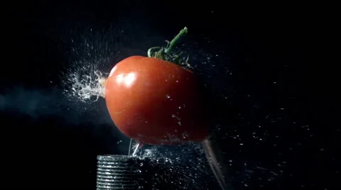 Slow motion of 50 cal. bullet hitting tomato Stock Footage 62341785