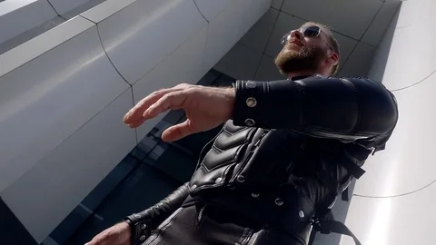 Slow motion. 500 frames second. stylish man with a beard in sunglasses in Stock Footage 79214818