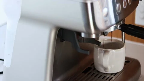 Slow motion 60fps gimbal slide of a coffee shot being poured Stock Footage 232917441