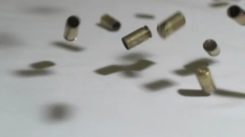 Slow Motion 9mm Bullet Shell Casings Falling Video stock 35996016