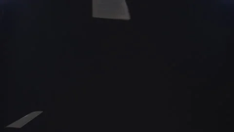 Slow Motion Abstract of Documents Falling Through the Darkness Video stock 210220954