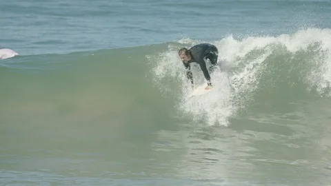 SLOW MOTION ACTION SHOT SURFER RIDING WAVES Stock Footage 127446637