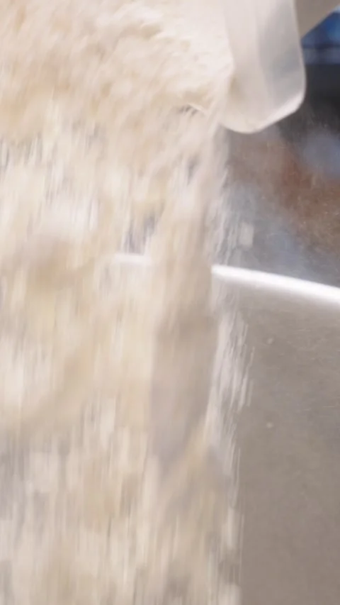 Slow Motion Adding Flour to an Industrial Dough Mixer Video stock 345252894