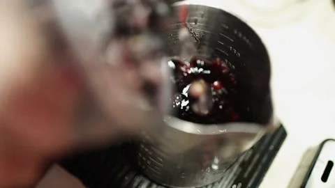 Slow Motion Adding Frozen Berries into Pitcher with Berry Infusion Stock Footage 312262502