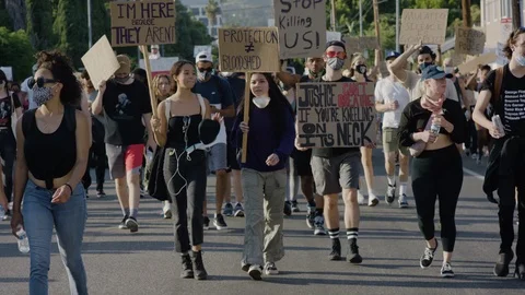Slow motion of adults marching down the street, BLM, Hollywood, LA, June 2020 Stock Footage 134637364