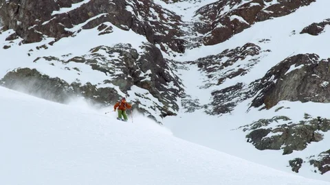 Slow motion of advanced freerider skiing down rocky terrain in Portillo resort Stock Footage 121597344