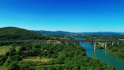 Slow motion Aerial 4K view rail bridge Freccia Rossa ETR 1000 Train passes by Stock Footage 196233435