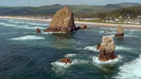 Slow motion aerial approaching shot of Haystack Rock in Cannon Beach, Oregon. Stock Footage 311582012