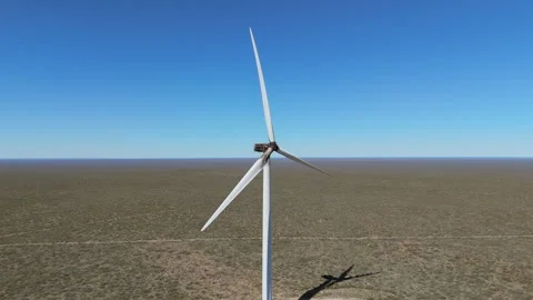 Slow-motion aerial close view of a damaged windmill still functioning. Video stock 293039597