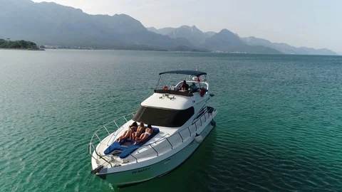 Slow Motion Aerial Drone Shot Over Small Speed Boat Boat Rushing Toward Exotic C Stock Footage 101127448