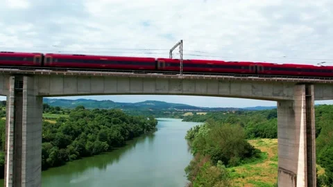 Slow Motion-Aerial go up Train Freccia Rossa ETR 1000-4K Rail bridge passes by  스톡 동영상 196784688
