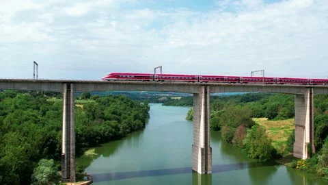 Slow Motion-Aerial go up Train Freccia Rossa ETR 1000-Rail bridge passes by Stock Footage 196785650