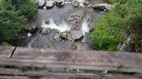 Slow Motion Aerial Pullback Over Waterfall and Bridge in Waubaushene, Ontario Video stock 316542748