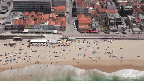 Slow Motion Aerial of Summer Crowd on Portuguese Beach Stock Footage 332575498