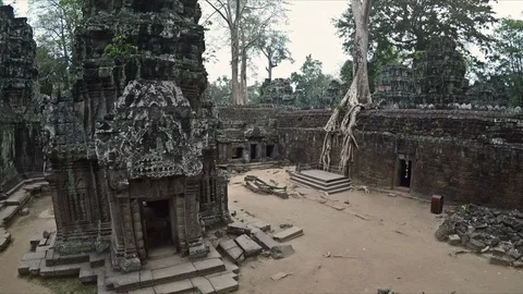 Slow Motion Aerial Through Ancient Buddhist Temple Filled with Trees 스톡 동영상 90236692
