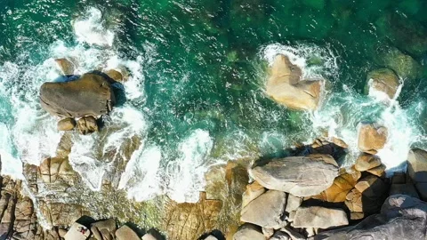 SLOW MOTION : Aerial top view of ocean waves, Beautiful tropical beach and rocky Stock-Footage 130656905