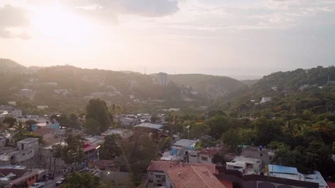 Slow Motion Aerial View of Carrefour Town in Haiti at Sunset Stock Footage 102765191