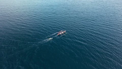 Slow Motion Aerial View Large Philippine Bangka Boat Towing Small Vessel Sea Stock Footage 326769688