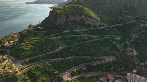 Slow Motion Aerial of Zig Zag Coastal Highway through Green Mountains Sant Stock Footage 329206855