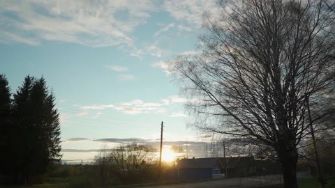 Slow motion against backdrop of sunset in picturesque village. Stock Footage 130667633