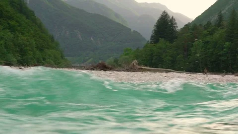 Slow motion of agitated Soca river water crossing the landscape, Slovenia. Stock Footage 111289115