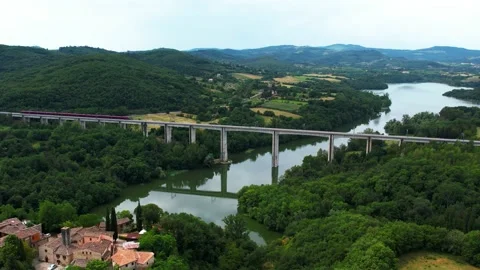 Slow Motion-AGV ITALO NTV 495 Aerial reverse 4K above rail bridge-Village Stock Footage 196755482
