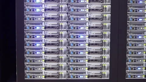 Slow motion of AI server racks blinking with blue LED lights in a dark room Stock Footage 331287968