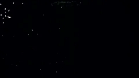 Slow motion air bubbles in water rising up to surface on black background Stock Footage 162939221