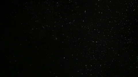Slow motion air particle practical effect on black Stock Footage 107990926