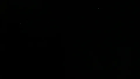 Slow motion air particle practical effect on black Stock Footage 107990943