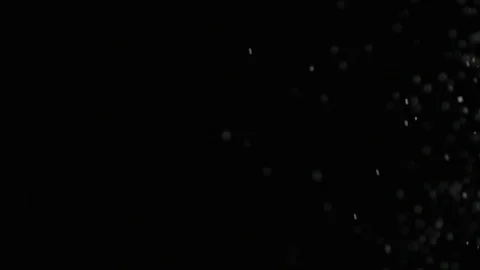 Slow motion air particle practical effect on black Stock Footage 107993537