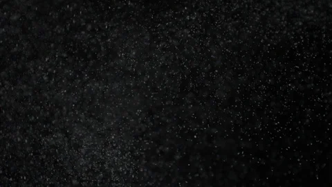 Slow motion air particle practical effect on black Stock Footage 107993540